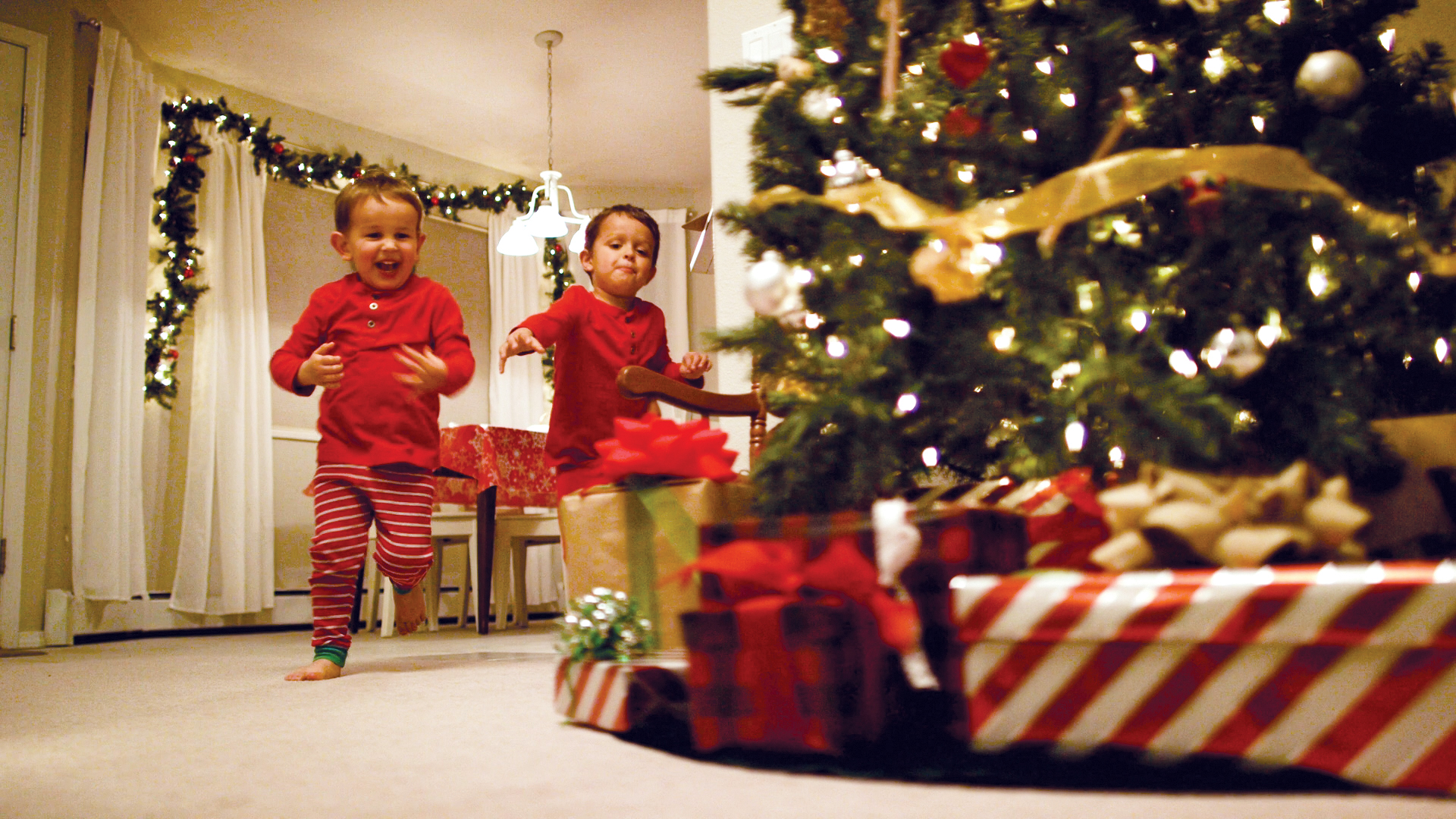 boys running to open presents